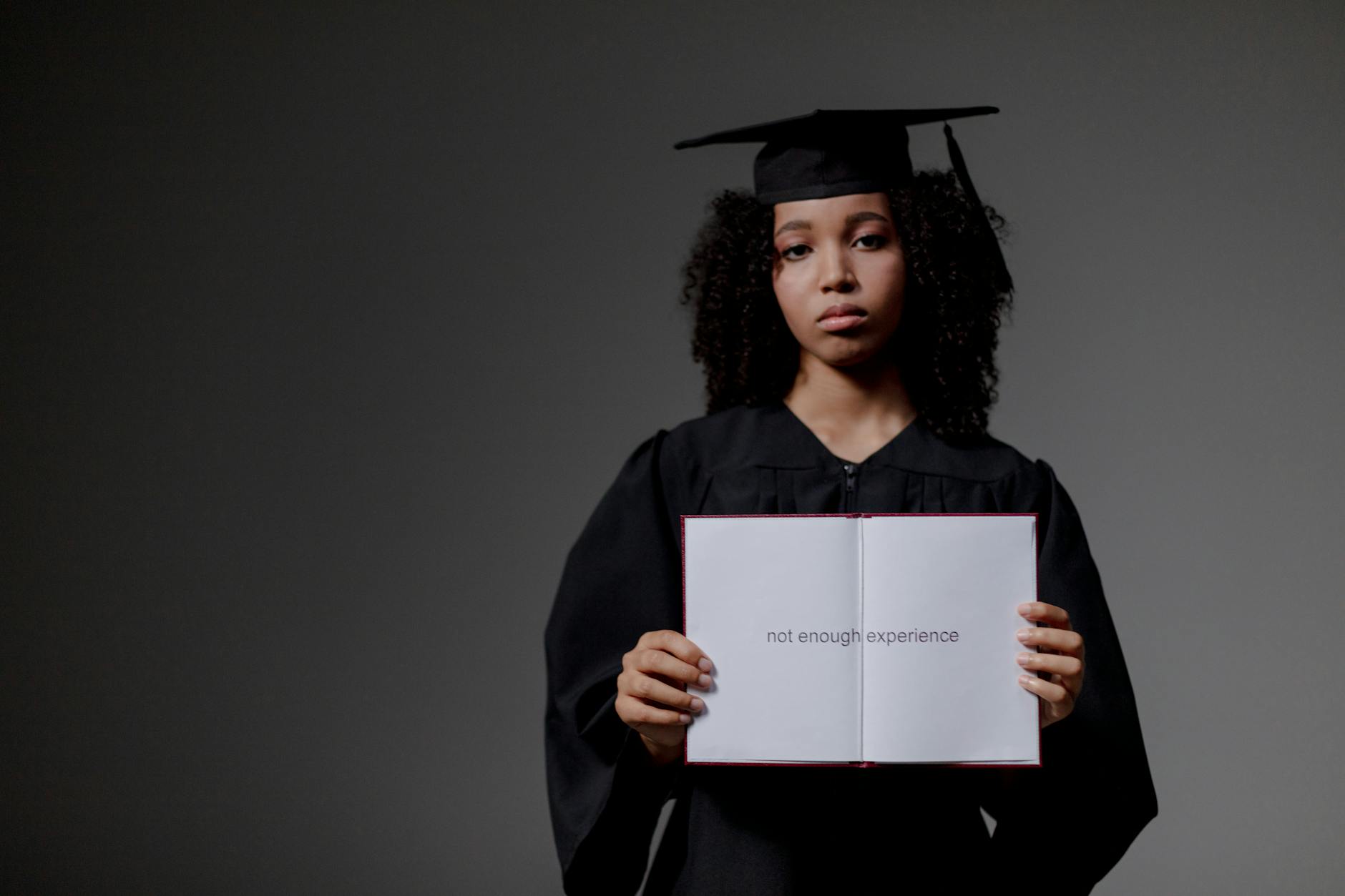 Young South African graduate searching for jobs on laptop, frustrated by unemployment crisis 2026
